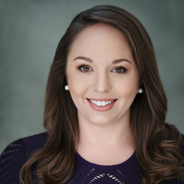 34b katey-rusch-010-linkedin Headshot image of Katey Rusch with gray background.